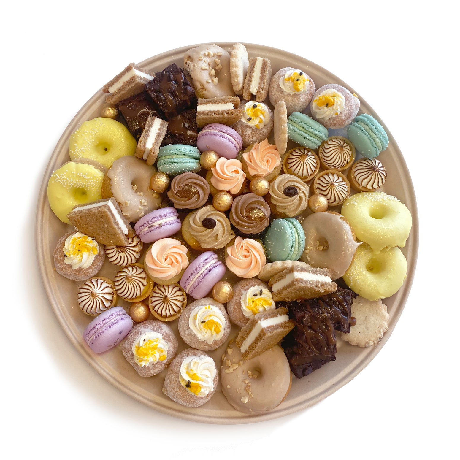 Assorted mini dessert party platter by Whippt Kitchen, featuring an elegant selection of bite-sized sweets including, but not limited to, mini cupcakes, tarts, brownies and macarons, arranged artfully for a celebration or event.